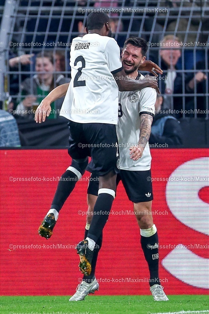 DFB23032501061 | 23.03.2025, Fußball, Viertelfinale UEFA Nations League, Deutschland - Italien, Signal Iduna Park, Saison 2024 2025: Torjubel nach dem Tor zum 3:0 durch Torschütze Tim Kleindienst (GER #09) zusammen mit Antonio Rüdiger (GER #02) DFB regulations prohibit any use of photographs as image sequences and or quasi-video.