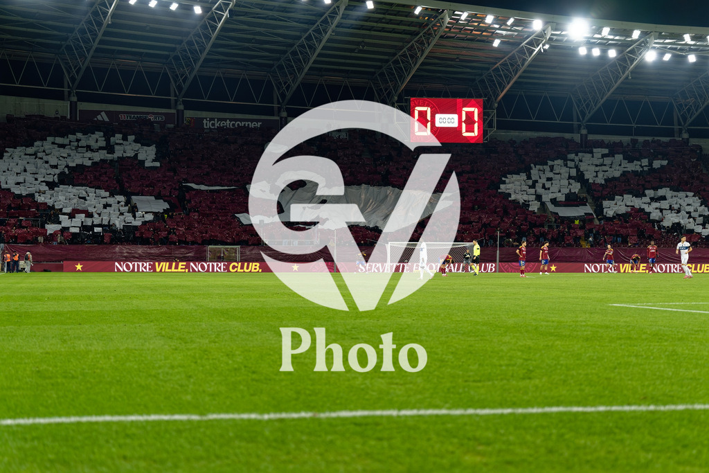 Brack Super League - Servette FC v FC Lausanne-Sport | Supporters of Servette FC with flags /banner  during the Brack Super League match between Servette FC and FC Lausanne-Sport at Stade de Geneve in Geneva, Switzerland