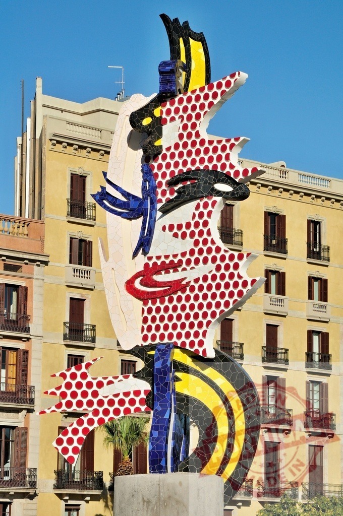 Roy Lichtenstein's El Cap de Barcelona sculpture displaying pop art style. Spain - Barcelona | Roy Lichtenstein's colorful mosaic sculpture El Cap de Barcelona standing in the city - Realized with Pictrs.com