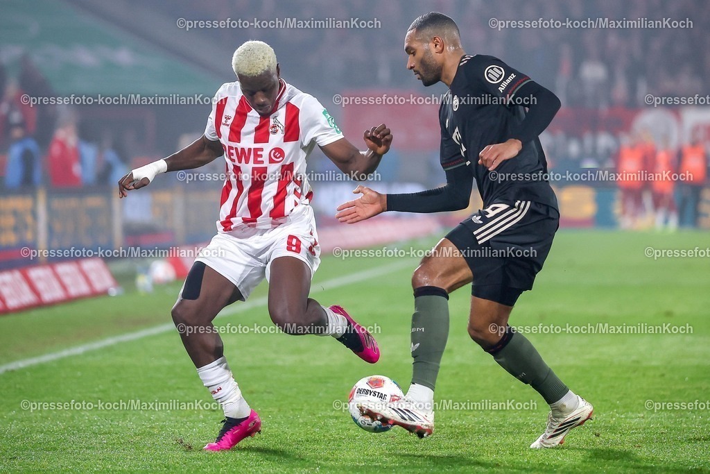 1FC14012601039 | 14.01.2026, Fußball, 1. FC Köln - FC Bayern München, 1. Fußball Bundesliga, 17. Spieltag, RheinEnergie-STADION, Saison 2025 2026: Ragnar Ache (1FC Koeln #09) im Zweikampf gegen  Jonathan Tah (FC Bayern Muenchen #04)  DFB regulations prohibit any use of photographs as image sequences and or quasi-video.