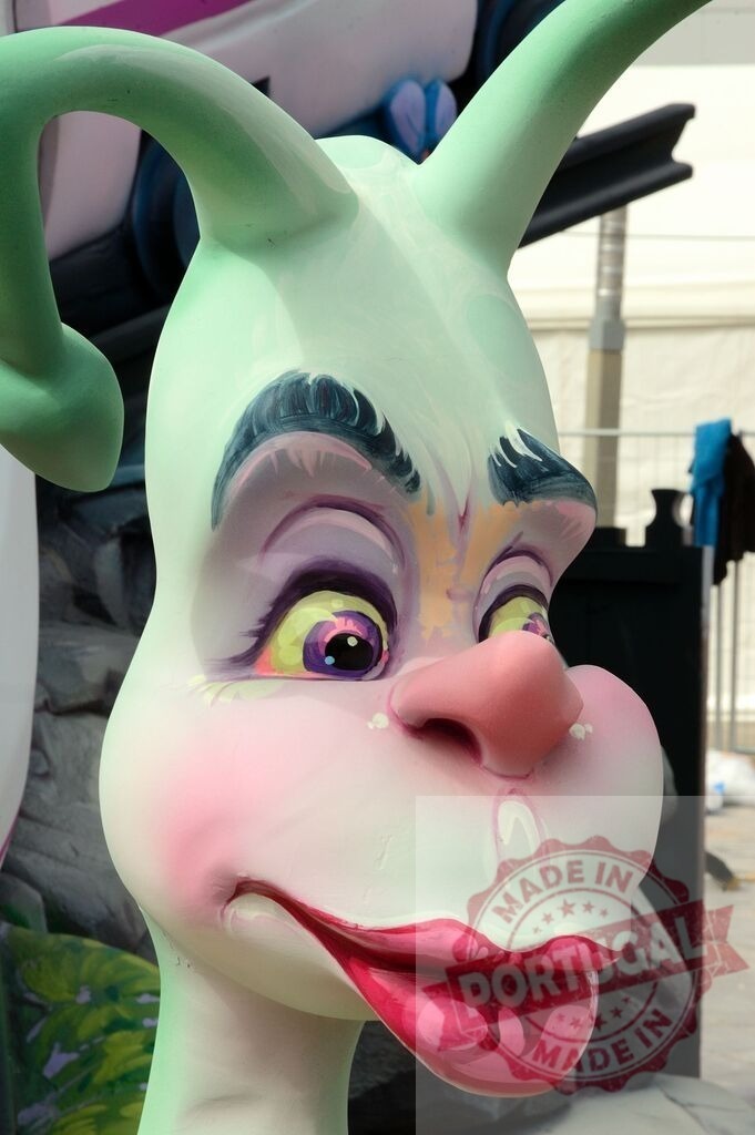Close-up of a colorful Fallas cartoon sculpture outdoors | Cartoon character sculpture close-up during Fallas festival - Realized with Pictrs.com