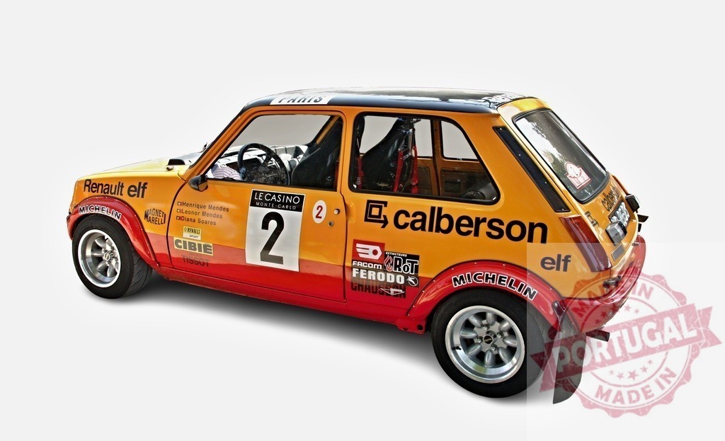 Renault 5 Turbo rally car competing in motorsport event | Renault 5 Turbo race car displayed with sponsor logos and competition number - Realized with Pictrs.com