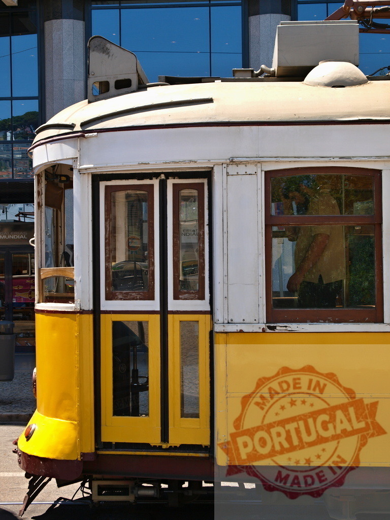 Yellow Lisbon Tram Showing Open Doors in Portugal | Yellow Lisbon tram showing open doors, reflecting the city's unique charm and transportation system - Realisiert mit Pictrs.com