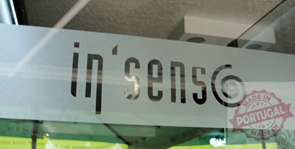 In'Sens text branding on frosted glass door | In'Sens brand logo and typography on a frosted glass office door - Realized with Pictrs.com