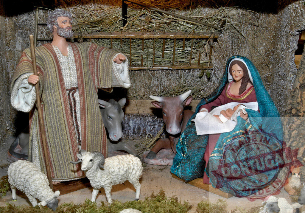 Nativity scene showing Saint Joseph presenting Baby Jesus, Mary and farm animals | Christmas nativity scene representing the birth of Jesus Christ with Mary, Joseph, ox, donkey and sheep - Realized with Pictrs.com