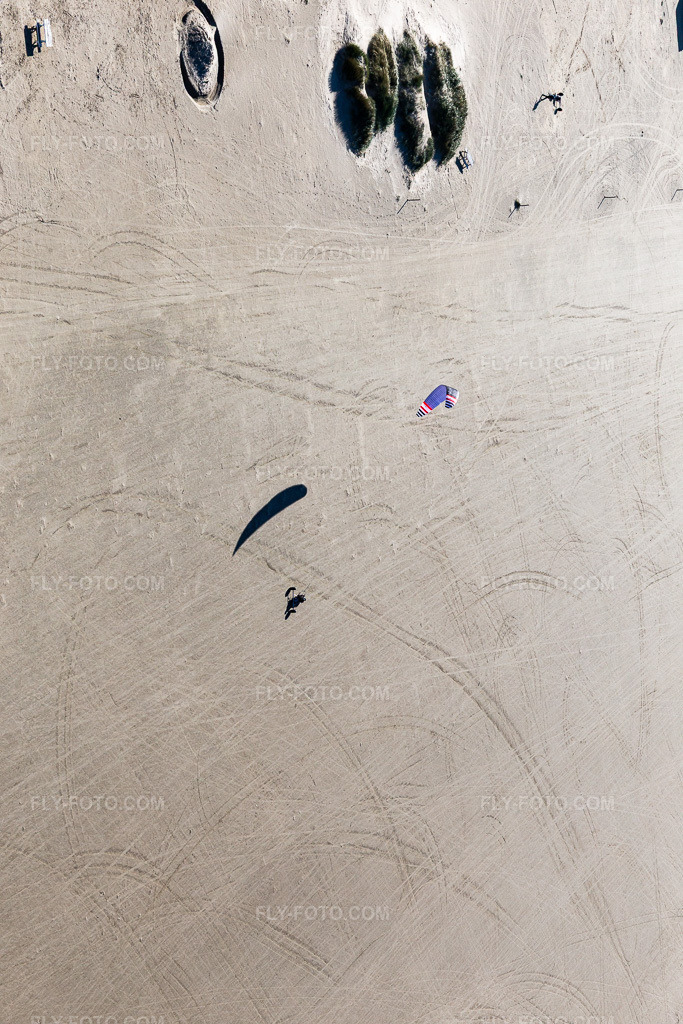Aerial view: Buggies and kiteboarders on the sandy beach in Fanø in the state South Denmark, Denmark.Photo: IMG_118636.jpg taken on 09/21/2019 by Werner Riehm/FLY-FOTO.comResolution of the original: 3648 x 5472 px