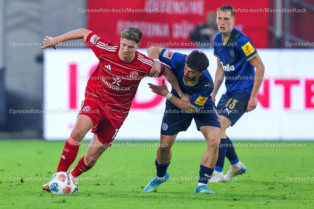 F9510042601112 | 10.04.2026, Fußball, Fortuna Düsseldorf - Holstein Kiel, 2. Fußball Bundesliga, Herren, Merkur Spiel-Arena, 29. Spieltag, Saison 2025 2026: Cedric Itten&nbsp;(Fortuna Düsseldorf #13) im Zweikampf gegen  Umut Tohumcu&nbsp; (Holstein Kiel #08)  DFB regulations prohibit any use of photographs as image sequences and or quasi-video.