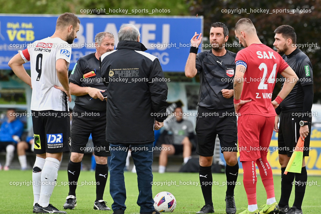 SVG Bleiburg vs. SAK 23.9.2023 | Münzwurf, #9 Adnan Besic (K) SVG Bleiburg, #24 Zoran Vukovic (K) SAK, Karl Krenn Referee, Roman Weger Referee, Almedin Medin Referee, SVG Bleiburg vs. SAK 23.9.2023, SVG Bleiburg vs. SAK am 23.09.2023 in Bleiburg (Karl Kornberger Stadion), Austria, (Photo by Bernd Stefan)