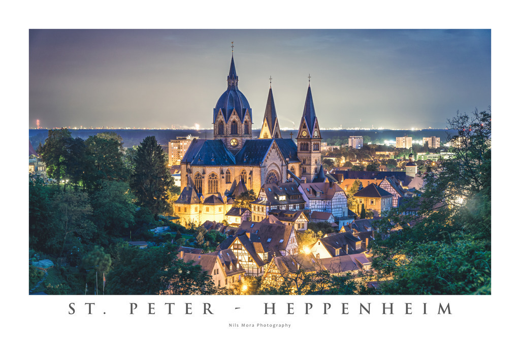St. Peter - Heppenheim | It is not surprising that the parish church of St. Peter in Heppenheim is popularly known as the "Cathedral of the Bergstrasse". With its imposing size, it clearly stands out from the surrounding town. When dusk falls, it is illuminated and put in a particularly pretty light. The skyscrapers and factories of Mannheim and Ludwigshafen can be seen on the horizon. - Realisiert mit Pictrs.com