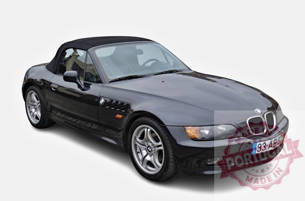Stylish black BMW Z3 convertible posing on white background | Modern BMW Z3 roadster parked, showcasing its sleek design and open-top elegance - Realisiert mit Pictrs.com