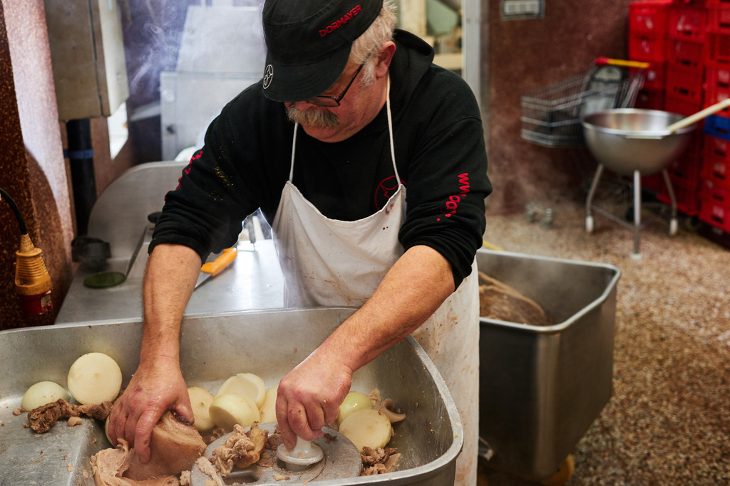 Fleischerei Dormayer | Langenzersdorf, Austria - February 12, 2019: Fleischerei Dormayer - Blutwurst Herstellung; Inhaber Franz Dormayer verteilt die Zutaten im Kutter. - Realisiert mit Pictrs.com
