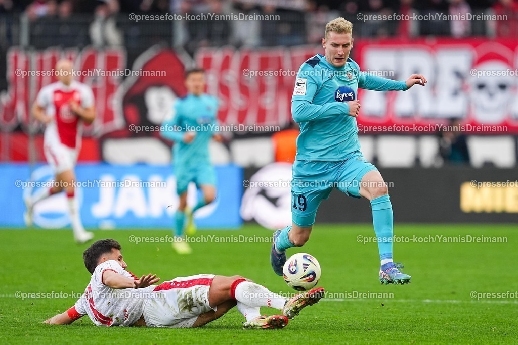 xYDRx18102501121 | 18.10.2025, xydrx, Fußball, 3.Liga, Rot-Weiss Essen - FC Viktoria Köln, Saison 2025 2026, Stadion an der Hafenstraße:  Ahmet Arslan (Rot-Weiss Essen #6) im Zweikampf gegen Meiko Sponsel (FC Viktoria Köln #19)    DFB regulations prohibit any use of photographs as image sequences and or quasi-video.