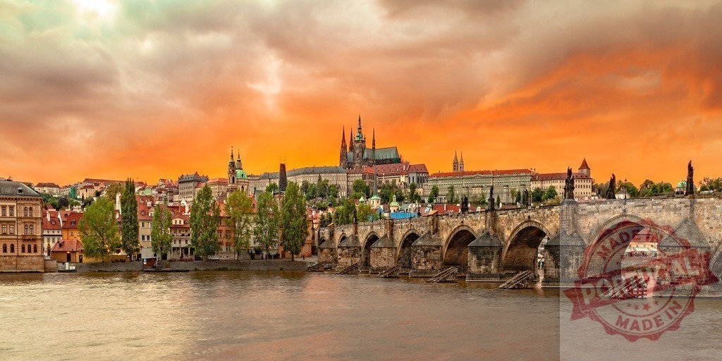 Prague Charles Bridge and Castle at dramatic sunset | Charles Bridge spanning Vltava River with Prague Castle and St. Vitus Cathedral under orange sky - Realisiert mit Pictrs.com