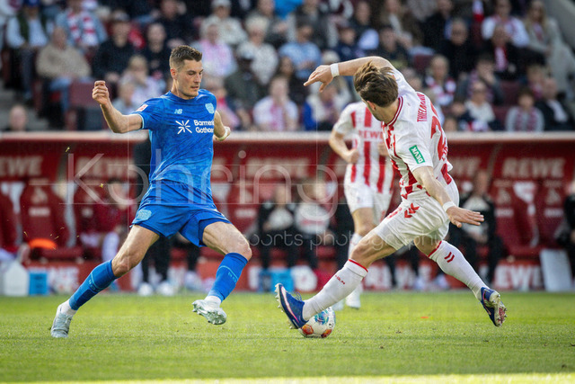German Bundesliga,  1. FC Koeln - Bayer 04 Leverkusen, 25.04.2026 | KOELN, GERMANY - APRIL 25, 2026 :  Patrik Schick (Bayer 04 Leverkusen, 14), Jan Thielmann (1. FC Koeln, 29) during the German Bundesliga match on gameday 31 between 1. FC Koeln - Bayer 04 Leverkusen at RheinEnergieSTADION on April 25, 2026 in Koeln, Germany. DFL REGULATIONS PROHIBIT ANY USE OF PHOTOGRAPHS AS IMAGE SEQUENCES AND/OR QUASI-VIDEO.