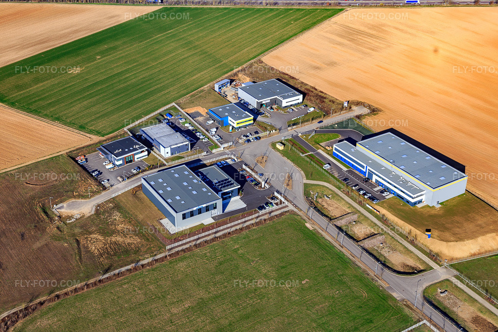 Aerial view: Rue de Dublin industrial park with Kiehl, Otelo Strasbourg and Société THERMIEXPERT in Mommenheim in the state Bas-Rhin, France. – Photo: IMG_097629.jpg taken on 03/16/2017 by Werner Riehm/FLY-FOTO.com – Resolution of the original: 5472 x 3648 px – WWW.OTELO.FR – THERMIEXPERT - Climatisation de Brumath à Colmar