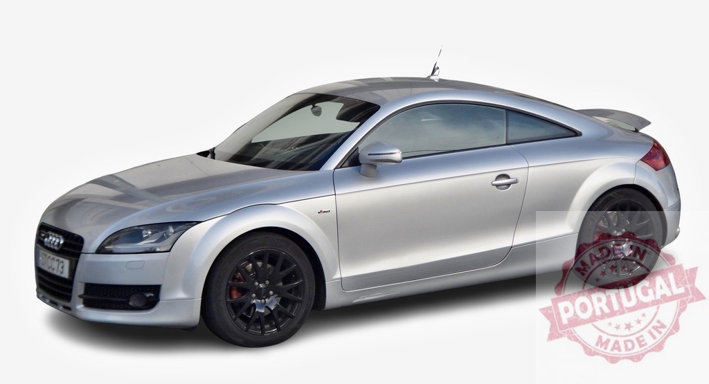 Silver Audi TT sports car parked, embodying speed and luxury | Sleek silver Audi TT coupe exudes power and performance, parked against a white background - Realized with Pictrs.com