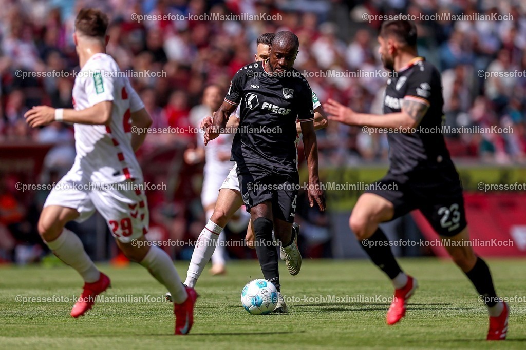 1FC20042501057 | 20.04.2025, Fußball, 1. FC Köln - Preußen Münster, 2.. Fußball Bundesliga, 30. Spieltag, RheinEnergie-STADION, Saison 2024 2025: David Kinsombi (Preussen Muenster #04) im Zweikampf gegen Dejan Ljubicic (FC Koeln #7) DFB regulations prohibit any use of photographs as image sequences and or quasi-video.