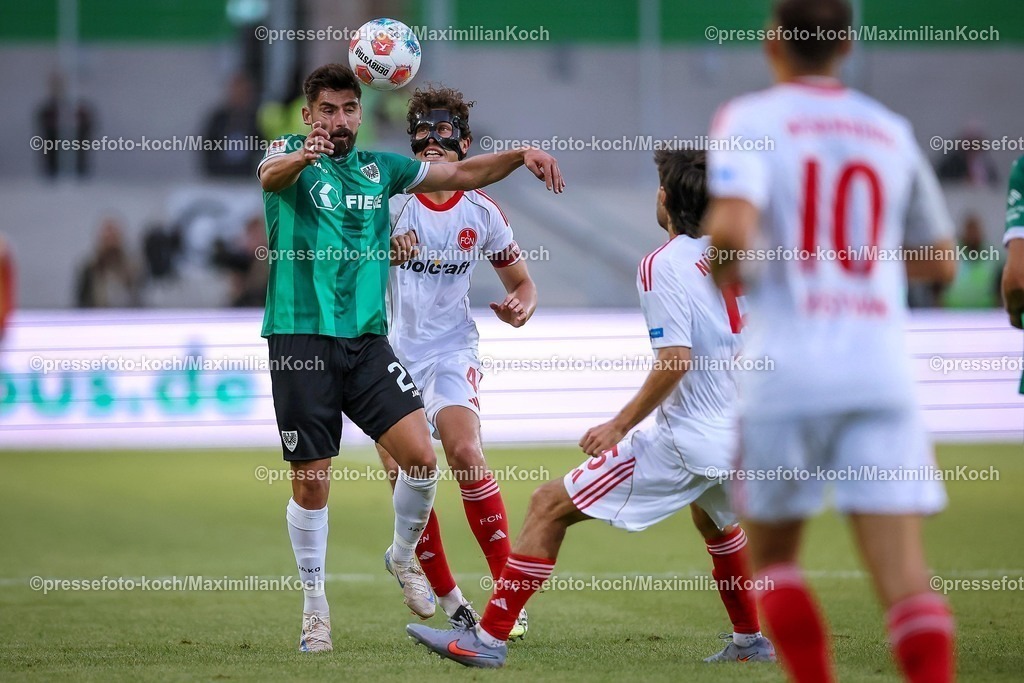 PRM22082501136 | 22.08.2025, Fußball, Preußen Münster - 1. FC Nürnberg, 2. Fußball Bundesliga,  Preußenstadion, Saison 2025 2026: Malik Batmaz&nbsp;(Preussen Muenster #23) im Zweikampf gegen  Fabio Gruber&nbsp;(1FC Nuernberg #04)  DFB regulations prohibit any use of photographs as image sequences and or quasi-video.