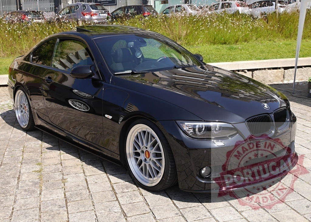 Black BMW E92 coupe showcasing custom BBS wheels | Sports car parked on cobblestone pavement, showing luxury and unique tuning details - Realisiert mit Pictrs.com