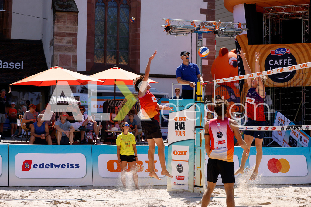 Obi BeachTour 2026 - Basel | BASEL, SWITZERLAND - JULY 18: DANIEL ALLEMANN (SUI) attack / spike against JACOB HEJLSVIG PETERSEN (DEN) block during the Obi BeachTour 2026 match between ALLEMANN / LEFFLER (SUI) and MASSEREY / SCHNEGG (SUI) at Barfüsserplatz on July 18, 2026 in Basel, Switzerland. - Realisiert mit Pictrs.com