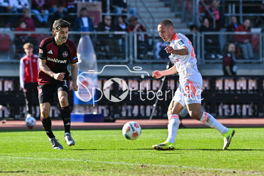 1. FC Nürnberg - Fortuna Düsseldorf | NUREMBERG, GERMANY - 07. MARCH:  im Duell Tom BAACK (1. FC Nuernberg 5) und Marin LJUBICIC (Fortuna Düsseldorf 20) während dem Match zwischen dem 1. FC Nürnberg und Fortuna Düsseldorf am 25. Spieltag der 2. Bundesliga im Max Morlock Stadion / DFL REGULATIONS PROHIBIT ANY USE OF PHOTOGRAPHS AS IMAGE SEQUENCES AND/OR QUASI-VIDEO