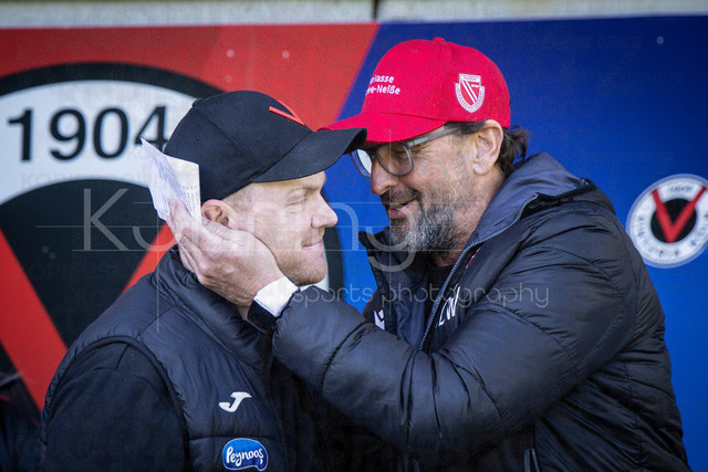German 3rd Division, Viktoria Koeln vs. Energie Cottbus, 26.04.2026 | KOELN, GERMANY - APRIL 26, 2026:  Marian Wilhelm (Cheftrainer FC Viktoria Koeln) and Claus-Dieter Wollitz (Head Coach Energie Cottbus) greets before the 3rd division match on gameday 35 between Viktoria Koeln vs. Energie Cottbus at the Sportpark Hoehenberg on April 26, 2026 in Koeln, Germany. DFL REGULATIONS PROHIBIT ANY USE OF PHOTOGRAPHS AS IMAGE SEQUENCES AND/OR QUASI-VIDEO.