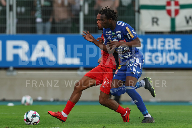 TSV Egger Glas Hartberg vs SK Rapid Wien – Championship Group    | Hartberg, Austria, 19.Apr.26 - SOCCER - ADMIRAL Bundesliga, TSV Egger Glas Hartberg vs SK Rapid Wien. The image shows Petter Nosa Dahl (SK Rapid Wien) and Habib Anas Coulibaly (Hartberg). 