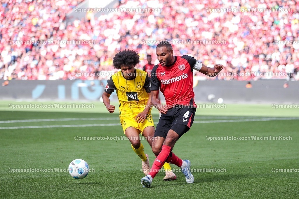 B0411052502248 | 11.05.2025, Fußball, Bayer 04 Leverkusen - Borussia Dortmund, 1. Fußball Bundesliga, 33. Spieltag, BayArena, Saison 2024 2025: Karim Adeyemi (BVB #27) im Zweikampf gegen Jonathan Tah (Bayer04 Leverkusen #4) DFB regulations prohibit any use of photographs as image sequences and or quasi-video.