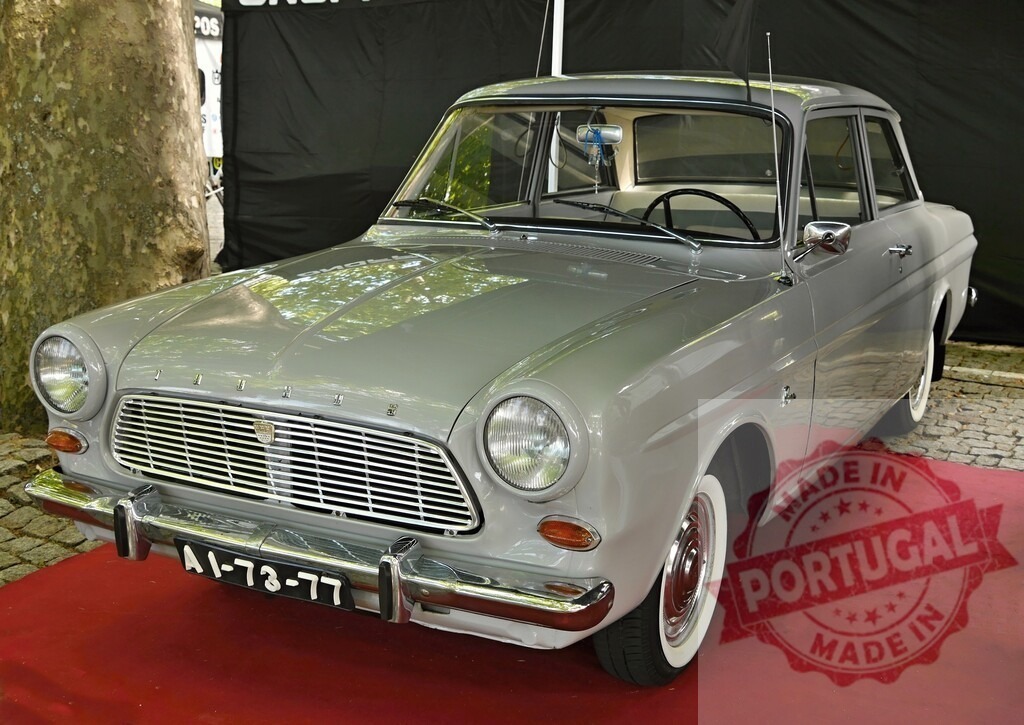 Ford Taunus 12M vintage car show display | Ford Taunus 12M classic sedan car standing on red carpet at an outdoor show - Realized with Pictrs.com
