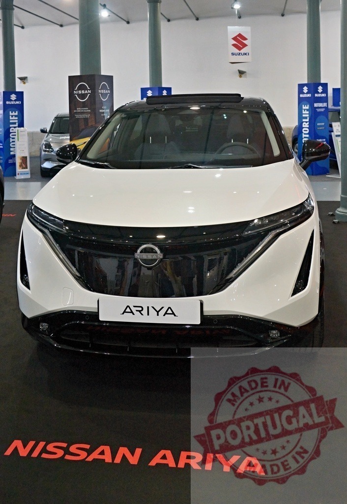 Nissan Ariya electric SUV exhibition motor show | Nissan Ariya electric SUV on display at an automotive exhibition - Realisiert mit Pictrs.com