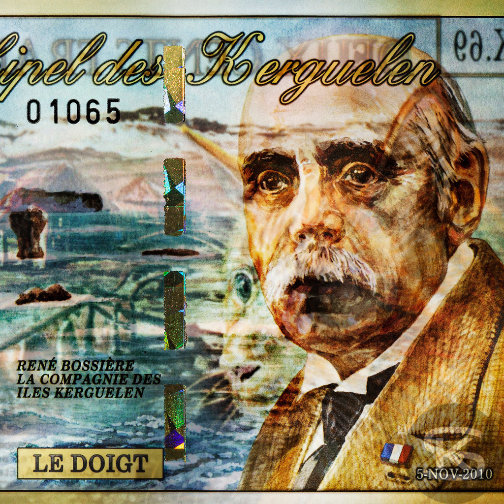 KERGUELEN ARCHIPEL - René Bossière | Siedler, 1857–1941  | Entdecken Sie "Gesichter der Währungen" – eine einzigartige Fotoserie von Stefan Kuhn, die Banknoten aus aller Welt als Kunstwerke neu interpretiert. Vorder- und Rückseite verschmelzen zu faszinierenden Kompositionen.  - Realisiert mit Pictrs.com