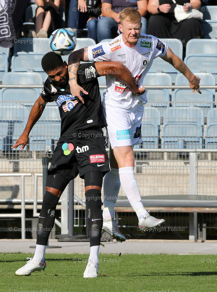 A_LUI_120823_0014 | SPORT,FUSSBALL,ADMIRAL BUNDESLIGA STURM GRAZ-AUSTRIA KLAGENFURT IM BILD:GREGORY WUETHRICH  (STURM GRAZ) UND JONAS ARWEILER (KLAGENFURT) FOTOLUI/MW