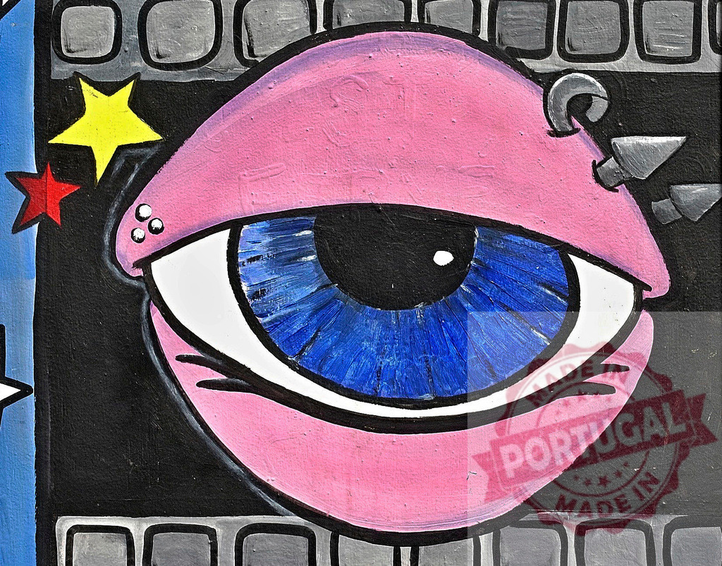Big brother is watching you: colorful street art representing an eye and stars | Urban art in the shape of an eye with piercings and stars, symbolizing surveillance and control - Realized with Pictrs.com