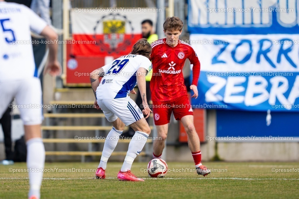 xYDR23022501009 | 23.02.2025, xydrx, Fußball, Fortuna Düsseldorf II (U23) - MSV Duisburg, Regionalliga West, Paul-Janes-Stadion: Tom Barth (Düsseldorf II #19) gegen Joshua Bitter (MSV #29)