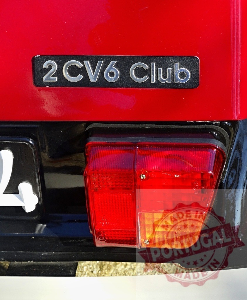 Citroën 2CV6 Club red vintage car tail light | Citroën 2CV6 Club emblem and red tail light on a vintage French automobile - Realized with Pictrs.com