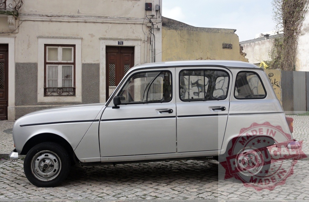 Silver Renault 4 parked on cobblestone street in Lisbon | Classic silver Renault 4 parked on a traditional cobblestone street in Lisbon, Portugal, offering a nostalgic glimpse into automotive history - Realized with Pictrs.com