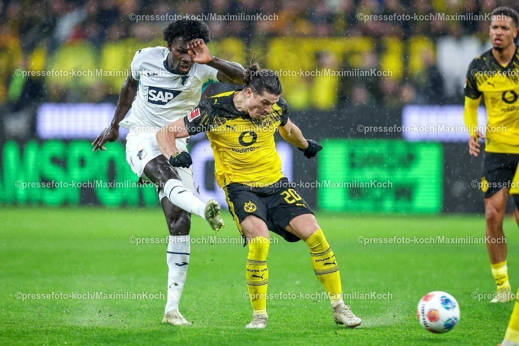 BVB07122501089 | 07.12.2025, Fußball, Borussia Dortmund - TSG 1899 Hoffenheimt, 1. Fußball Bundesliga, 13. Spieltag, Signal Iduna Park, Saison 2025 2026: Ihlas Bebou&nbsp;(TSG Hoffenheim #09) im Zweikampf gegen  Marcel Sabitzer&nbsp;(BVB #20)  DFB regulations prohibit any use of photographs as image sequences and or quasi-video.