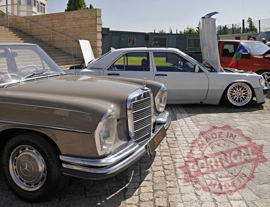 Mercedes-Benz classic sedan and custom models at car show | Mercedes-Benz vintage and modified sedans parked on a cobblestone street during an outdoor car show - Realized with Pictrs.com