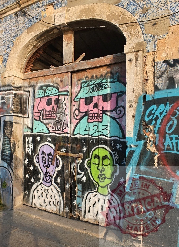 Urban street art mural decorating abandoned door | Colorful graffiti characters and skulls transforming a worn wooden door with vibrant street art - Realized with Pictrs.com