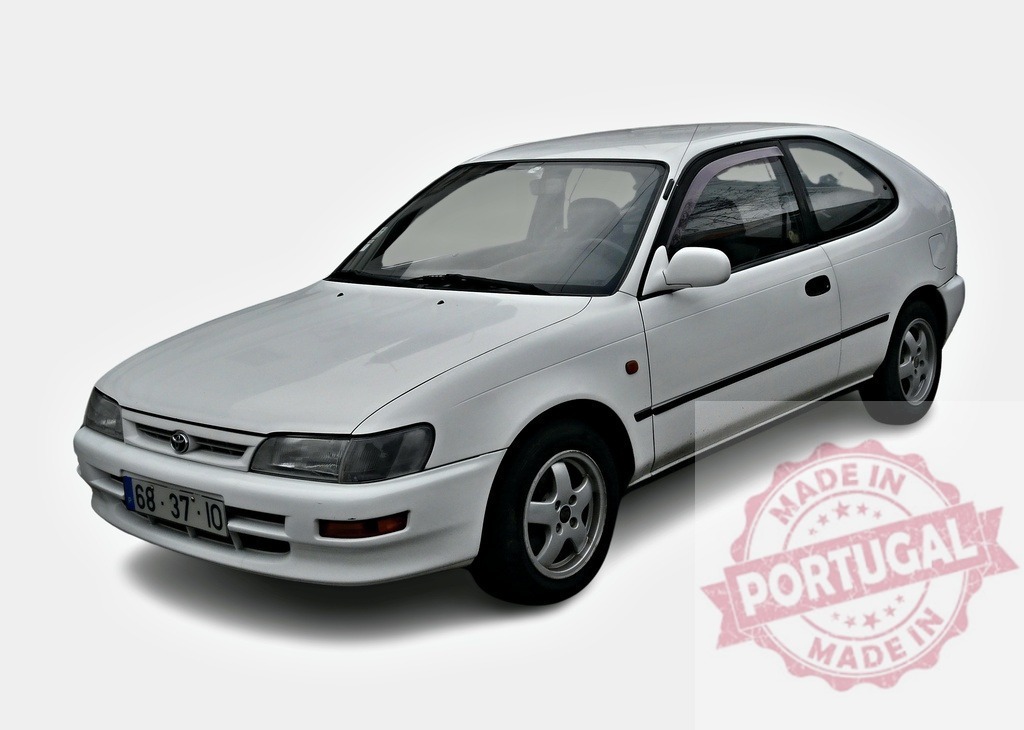 White Toyota Corolla E100 Hatchback standing still on white background | White Toyota Corolla E100 Hatchback on white background, three-door car, three-quarter view - Realized with Pictrs.com