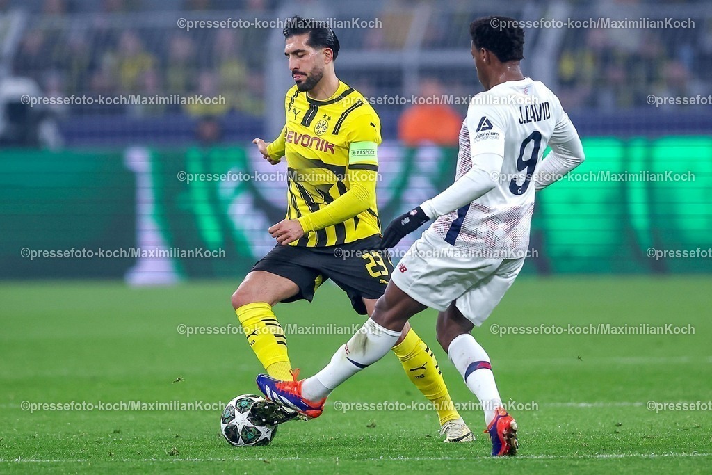 UCL04032501014 | 04.03.2025, Fußball, UEFA Champions League, Borussia Dortmund - OSC Lille, Signal Iduna Park, Runde der 16, Saison 2024 2025: Emre Can (BVB #23) im Zweikampf gegen Jonathan David (LOSC Lille #9)