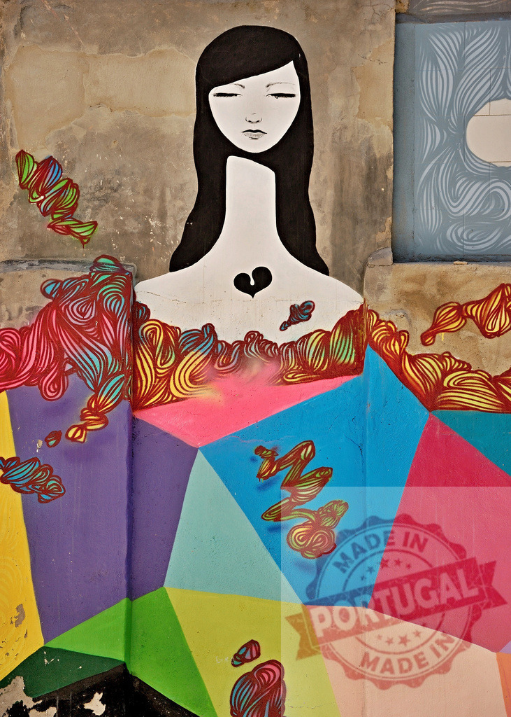 Colorful street art portrait depicting melancholic woman with broken heart on textured wall | Mural representing a sad woman with a broken heart, surrounded by colorful geometric shapes and organic lines - Realized with Pictrs.com