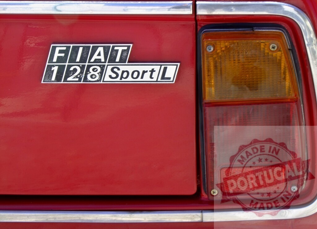 Fiat 128 Sport L emblem on vintage red car | Fiat 128 Sport L logo and taillight detail on a classic red automobile - Realized with Pictrs.com
