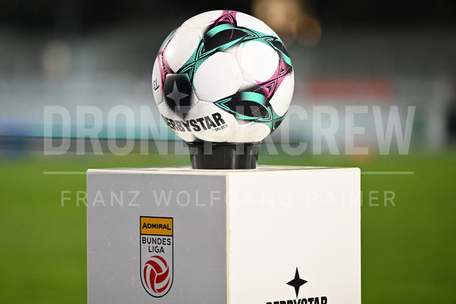 TSV Egger Glas Hartberg vs SV Oberbank Ried – Austrian Bundesliga Match | TSV Egger Glas Hartberg and SV Oberbank Ried. High-intensity match action, tackles, shots on goal, celebrations, fan atmosphere and stadium scenes captured in professional quality. The image shows the matchball.