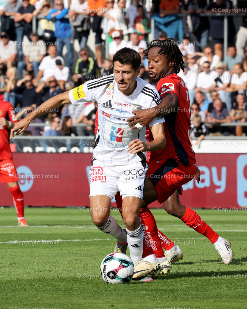 A_LUI_24082025_01 | SPORT,FUSSBALL,ADMIRAL BUNDESLIGA RZ PELLETS WAC-SK RAPID WIEN 24.08.2025 IM BILD:ALESSANDRO SCHOEPF  (WAC) UND  CLAUDY MBUYI (RAPID) FOTO:FOTOLUI/MW