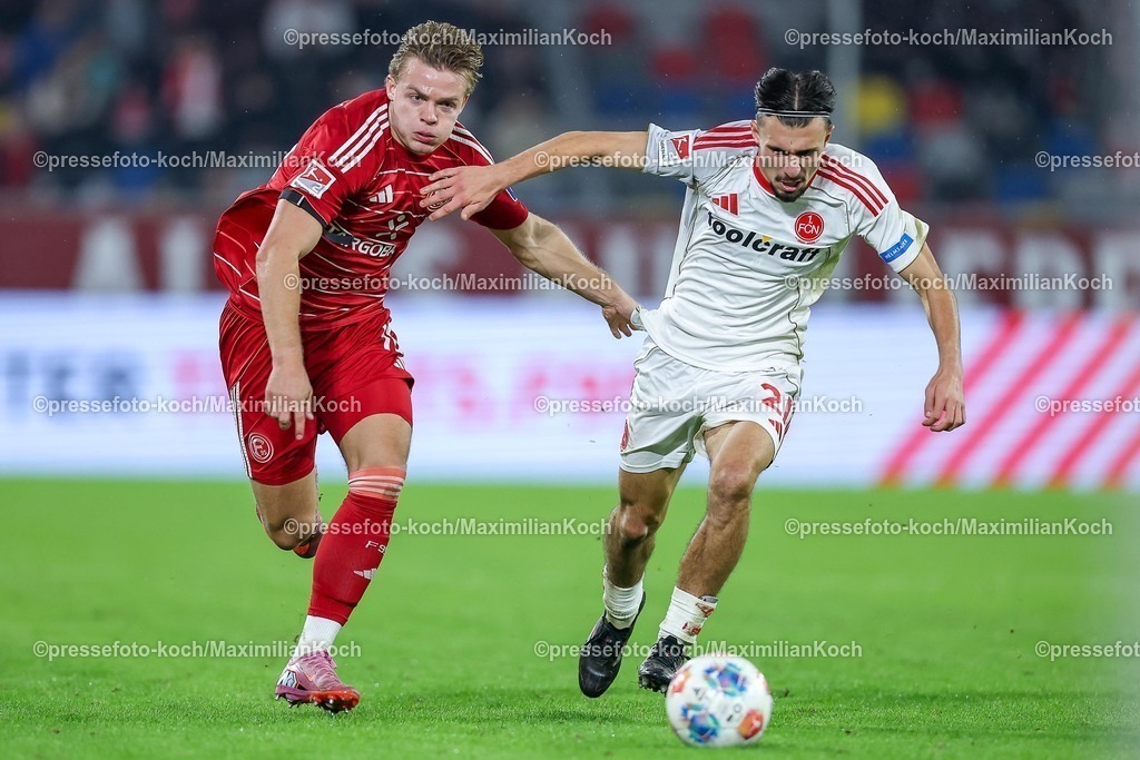 F9503102501331 | 03.10.2025, Fußball, Fortuna Düsseldorf - 1.FC Nürnberg, 2. Fußball Bundesliga, Merkur Spiel-Arena, Saison 2025 2026: Christian Rasmussen (Fortuna Düsseldorf #10) im Zweikampf gegen  Berkay Yilmaz (1FC Nuernberg #21)  DFB regulations prohibit any use of photographs as image sequences and or quasi-video.