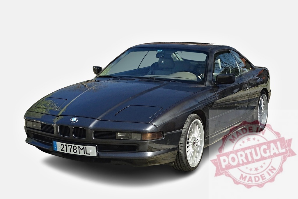 Classic BMW 8 Series parked, representing luxury and performance | Dark BMW 8 series parked on a white background, showcasing its elegant design and powerful engine - Realisiert mit Pictrs.com