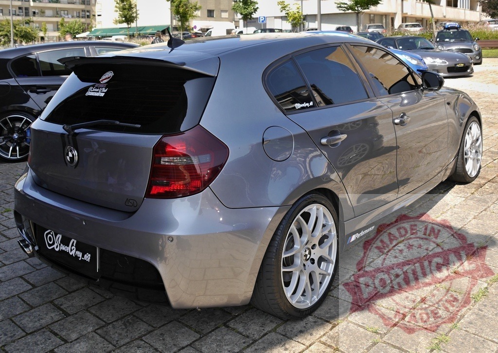 Custom grey BMW 1 series hatchback at car meet | Grey BMW 1 Series hatchback featuring custom modifications parked with other cars - Realized with Pictrs.com