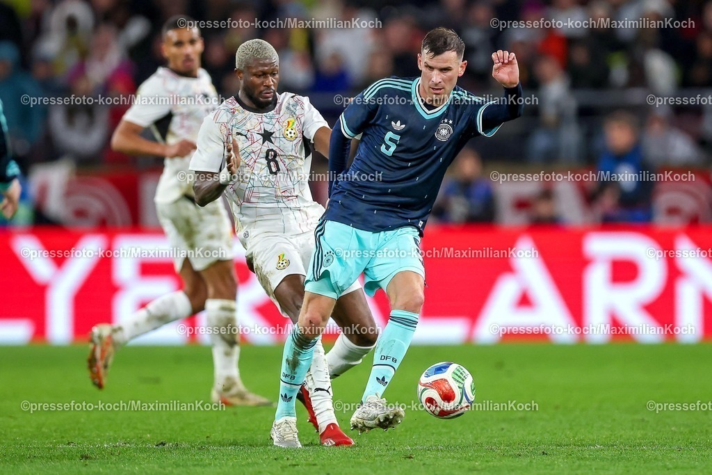 DFB30032600045 | 30.03.2026, Fußball, Länderspiel, Deutschland - Ghana, MHP-Arena (Stuttgart), Saison 2025 2026: Kwasi Sibo (Ghana #8) im Zweikampf gegen  Pascal Groß (GER #05)  DFB regulations prohibit any use of photographs as image sequences and or quasi-video.