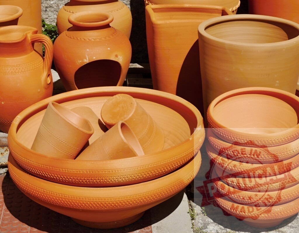 Traditional terracotta pottery vessels and clay craft items | Assortment of handmade artisan terracotta pottery, including pots, bowls, and jars - Realized with Pictrs.com